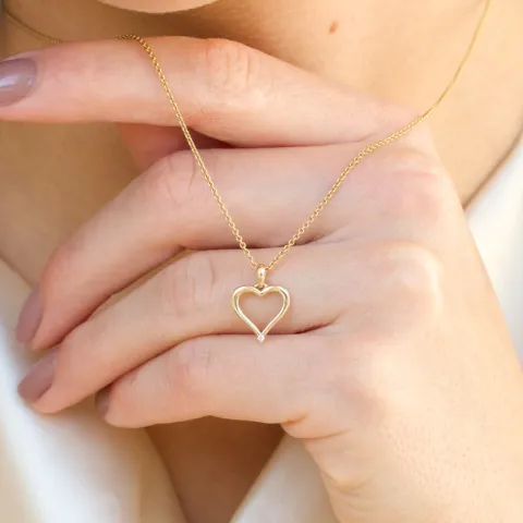 sydän timanttiriipus 14 karaatti kultaa 0,01 ct
