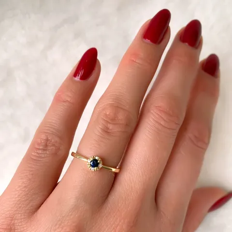 pyöreä safiiri timanttisormus 14 karaatin kultaa 0,02 ct 0,163 ct