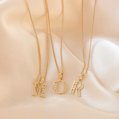 o-kirjain riipus 14 karaatti kultaa 0,03 ct