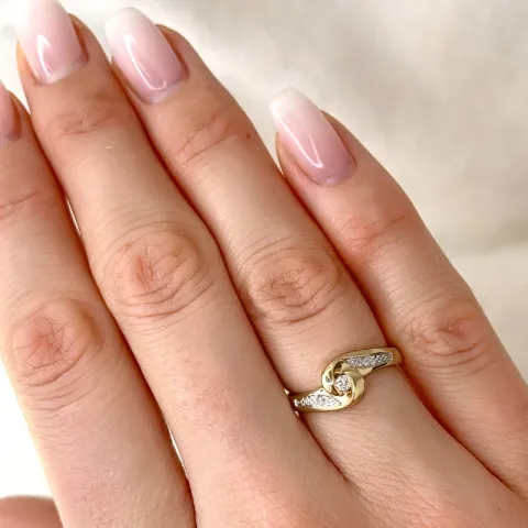 abstrakti timanttisormus 9 karaatin kulta ja valkokultaa 0,05 ct