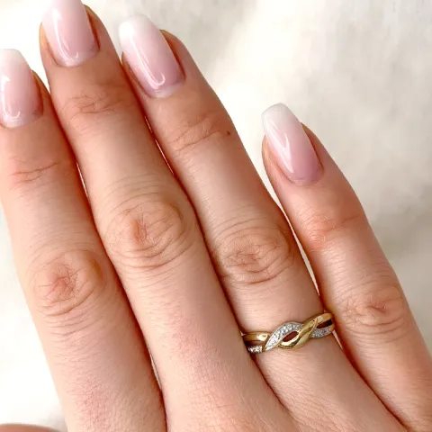 elegantti abstrakti timantti sormus 9 karaatin kulta ja valkokultaa 0,02 ct