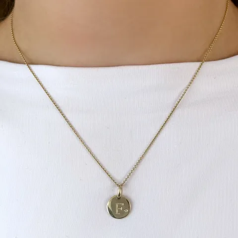 f-kirjain timantti riipus 9 karaatti kultaa 0,01 ct