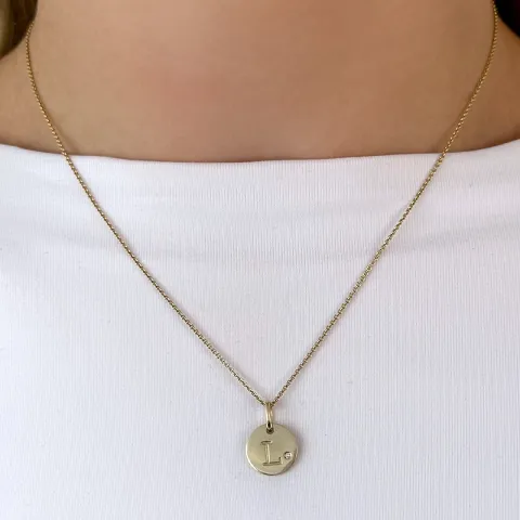 l-kirjain timantti riipus 9 karaatti kultaa 0,01 ct