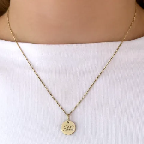 m-kirjain timantti riipus 9 karaatti kultaa 0,01 ct