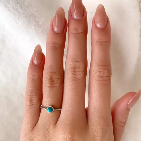 Pyöreä sininen sormus hopeaa