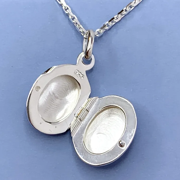 12 x 15 mm ovaali medaljonki  hopeaa