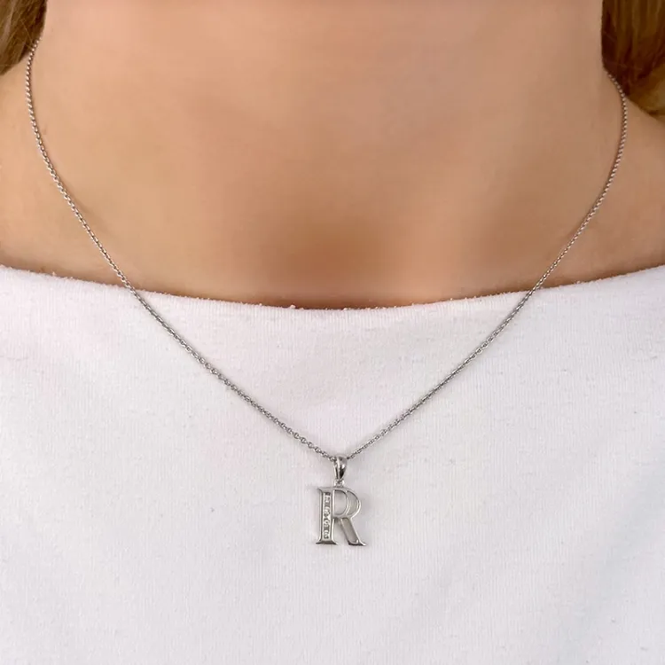 r-kirjain riipus 14 karaatti valkokultaa 0,04 ct