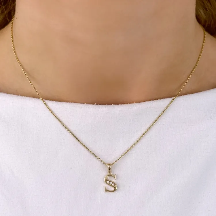 S-kirjain riipus 14 karaatti kultaa 0,025 ct