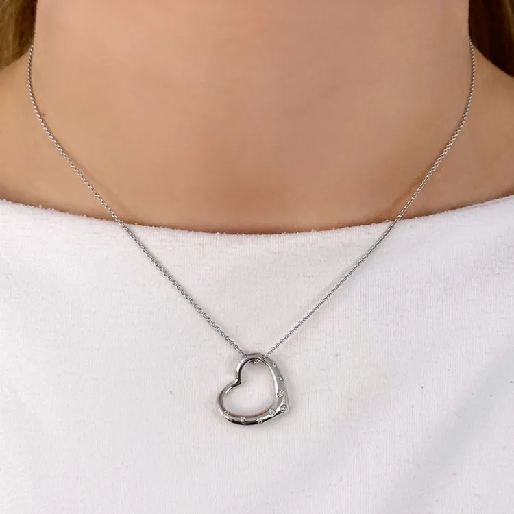 sydän riipus 14 karaatti valkokultaa 0,12 ct