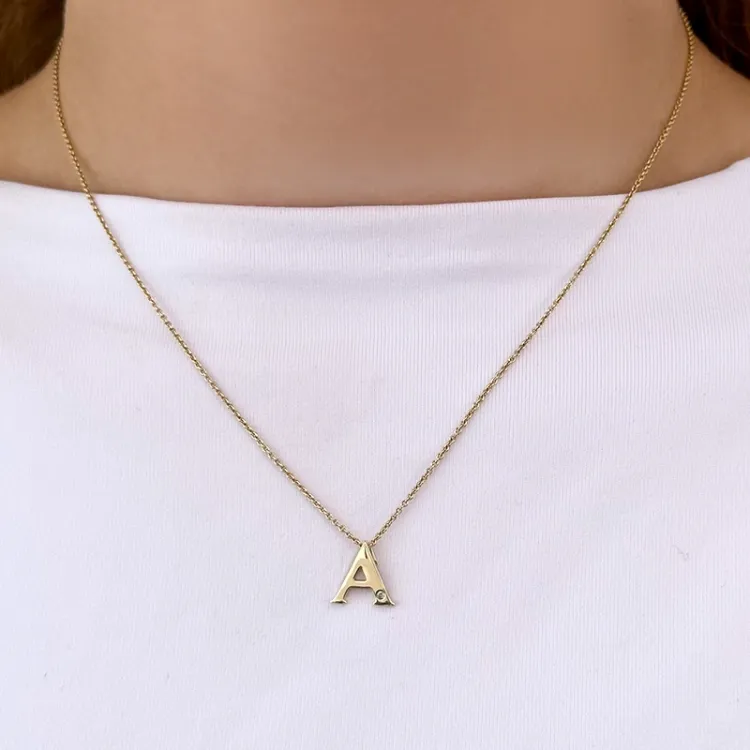 a-kirjain timantti riipus 9 karaatti kultaa 0,01 ct