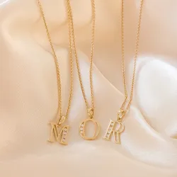 o-kirjain riipus 14 karaatti kultaa 0,03 ct