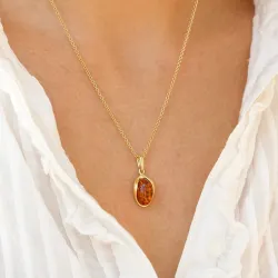 ovaali meripihka riipus  kullattua hopeaa