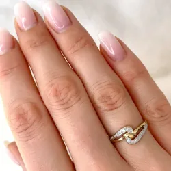 abstrakti timantti sormus 9 karaatin kulta ja valkokultaa 0,02 ct